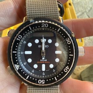 Seiko Prospex Arnie SNJ025 Watch - Black dial with tan nylon band.